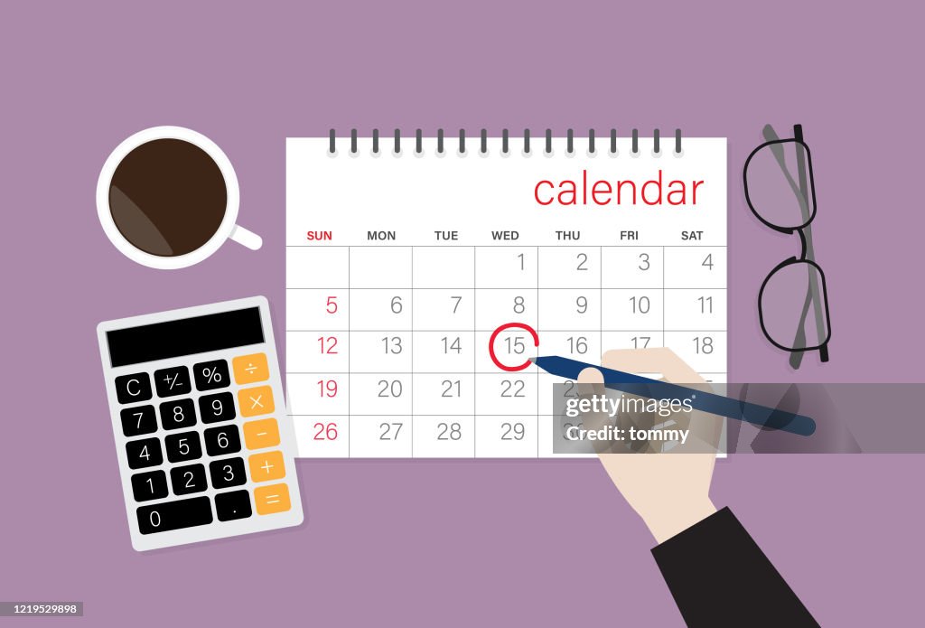 Businessman choose a date on a calendar