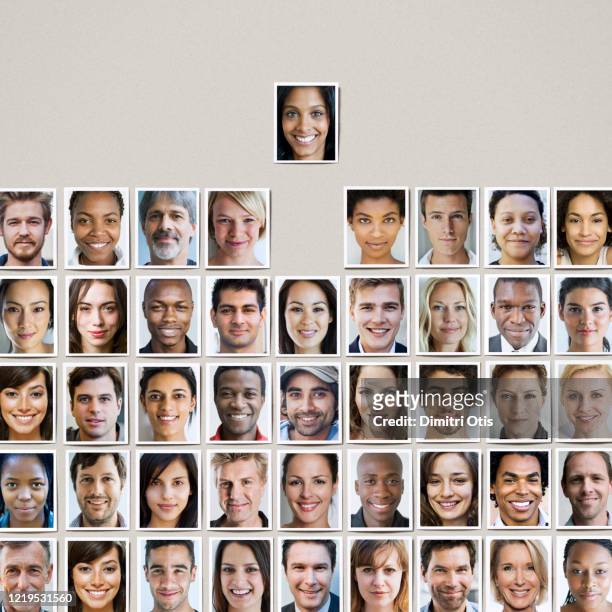portrait prints in grid formation, one standing out from the crowd - portrait grid stock pictures, royalty-free photos & images