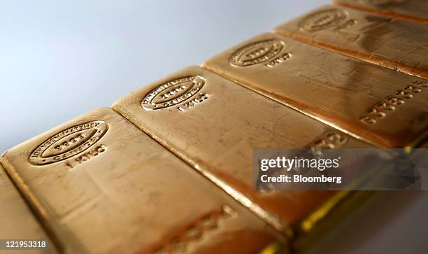 Gold bars are arranged for a photograph at Bullion Trading LLC in New York, U.S., on Tuesday, Aug. 23, 2011. Gold dropped the most in a year as some...