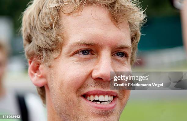 Sebastian Vettel poses for the media during the 50th birthday of the Kart Club Kerpen on August 24, 2011 in Kerpen, Germany.