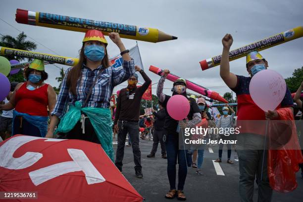Protesters wearing protective masks participate in a rally to protest president Dutertes Anti-Terror Bill on June 12, 2020 in Manila, Philippines....