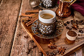 Traditional turkish coffee cup and roasted coffee beans