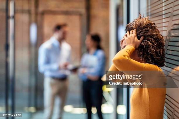 female african american office worker reacts negatively to bad news - conflict stock pictures, royalty-free photos & images