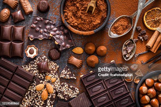 chocolate bars and cocoa powder shot from above - chocolate stock pictures, royalty-free photos & images