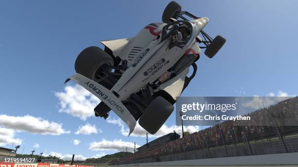 Kyle Busch, driver of the Rowdy Energy Dallara, flips in the air during the IndyCar iRacing Challenge Firestone 175 at virtual Twin Ring Motegi on...