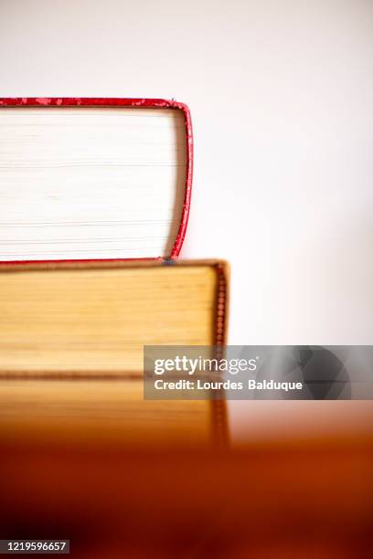 old books on a table - reliures photos et images de collection