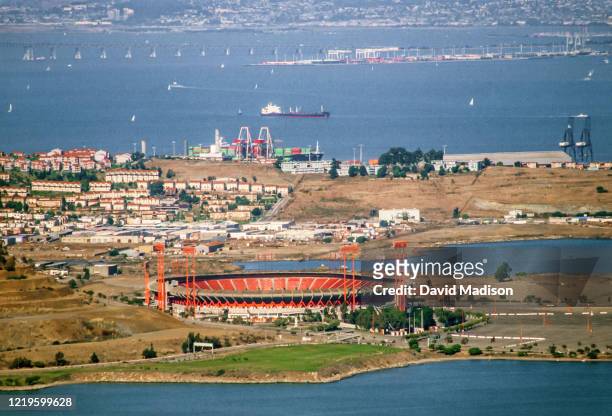 An aerial view of Candlestick Point, Candlestick Park stadium, Hunter's Point, and the San Francisco Bay looking east towards Alameda and Oakland...