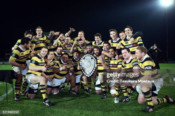Taranaki players celebrate winning the Ranfurly Shield after the round 12 ITM Cup match between Southland and Taranaki at Rugby Park Stadium on...