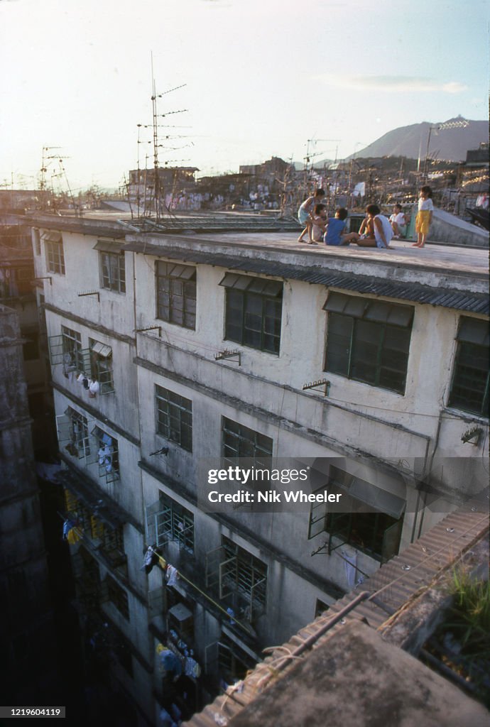 Children Play on Unfenced Skyscraper Rooftop in Hong Kong