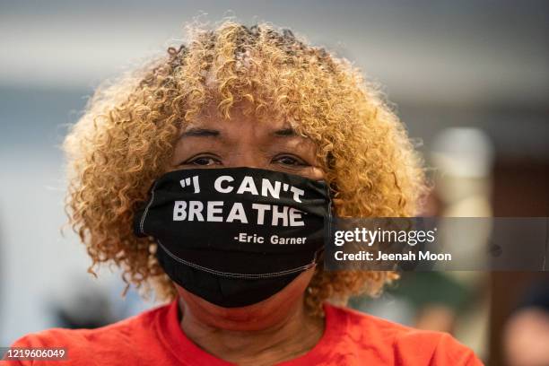 Gwen Carr, the mother of Eric Garner, wearing a protective mask attends New York Governor Andrew Cuomo's daily media briefing at the Office of the...
