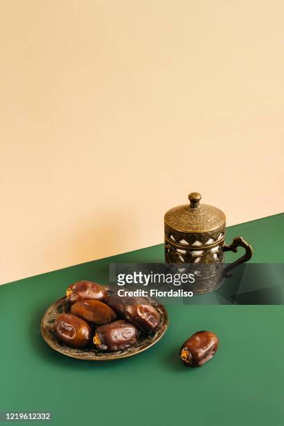 turkish metal coffee cup with lid and saucer with dates - ramadan food stock pictures, royalty-free photos & images