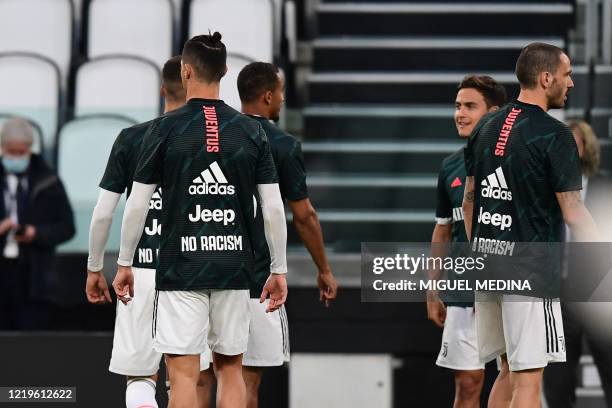 Juventus' Portuguese forward Cristiano Ronaldo , Juventus' Argentine forward Paulo Dybala , Juventus' Italian defender Leonardo Bonucci and teammates...