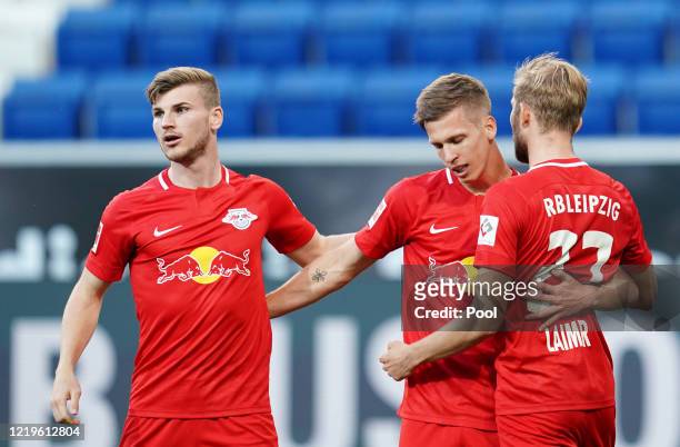Dani Olmo of Leipzig celebrates after scoring his sides first goal with Timo Werner during the Bundesliga match between TSG 1899 Hoffenheim and RB...