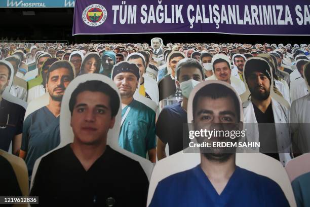 General view shows cardboards with one picture of Mustafa Kemal Ataturk , founder of modern Turkey, and photographs of medical staff on the stands in...
