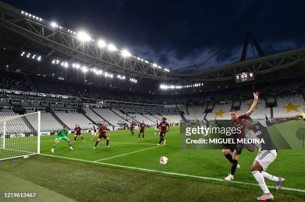 Juventus' Brazilian forward Douglas Costa challenges AC Milan's Italian defender Andrea Conti during the Italian Cup semi-final second leg football...