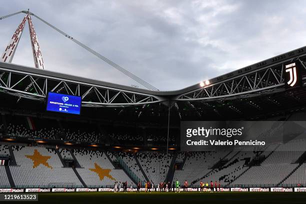 Players and referees stand for a minute of silence in honor of the victims of COVID-19 during the Coppa Italia Semi-Final Second Leg match between...