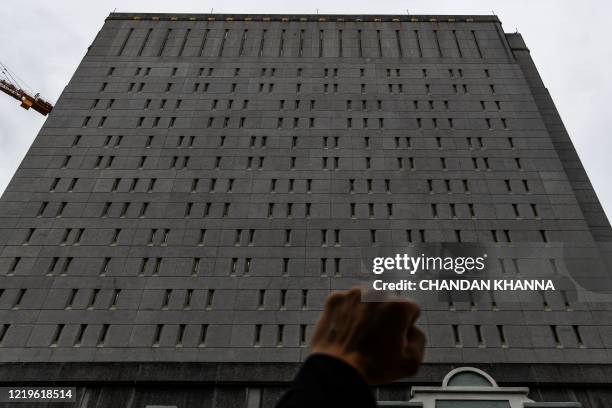 Protestors gather outside the federal detention center in Downtown Miami on June 12, 2020 in Miami, during a demonstration over the death of George...