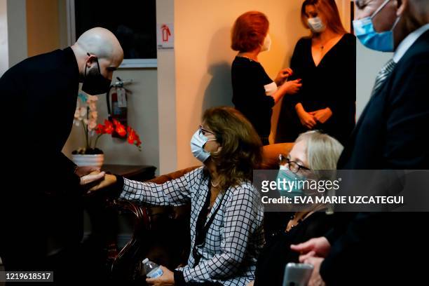 Fans of the late Cuban-American film actress and singer Rosita Furnes give her condolences to her daughter Rosa Maria Medel during the funeral at...