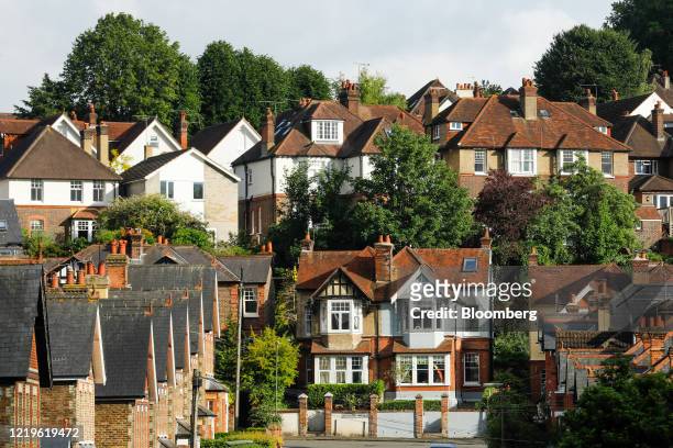 Residential properties stand in Guildford, U.K., on Friday, June 12, 2020. U.K. House prices fell the most in more than a decade and consumer...