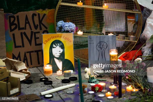 Shrine and a photo of Charleena Lyles are pictured in an area being called the Capitol Hill Autonomous Zone located on streets reopened to...