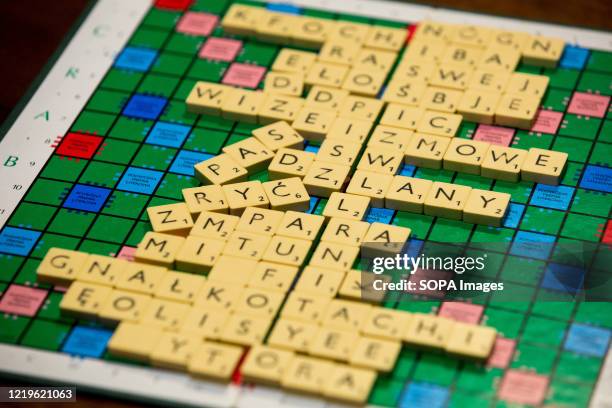 In this photo illustration a close-up of Scrabble board game letters is seen.