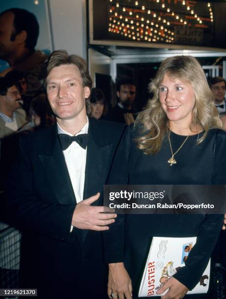 Musician Steve Winwood and his wife Eugenia Crafton attending the premiere of 'Buster' at the Odeon Leicester Square in London, England on 16...