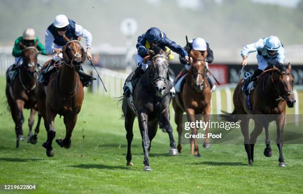 Jockey James Doyle riding Mubtasimah approach the finish line to win the Watch And Bet With MansionBet At Newbury Maggie Dickson Fillies' Stakes at...