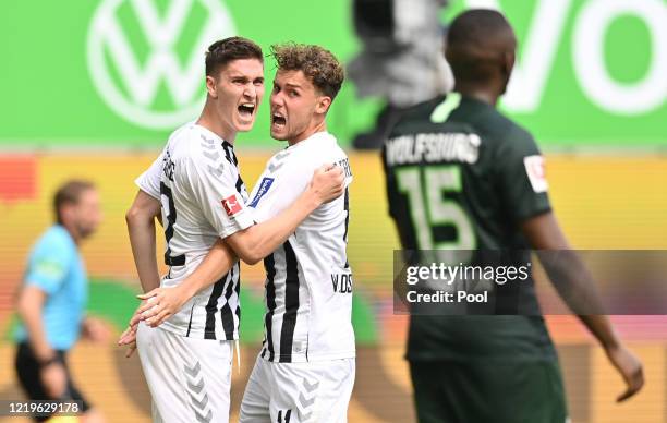 Roland Sallai of Sport-Club Freiburg celebrates after scoring his team's second goal with Luca Waldschmidt of Sport-Club Freiburg next to Jerome...