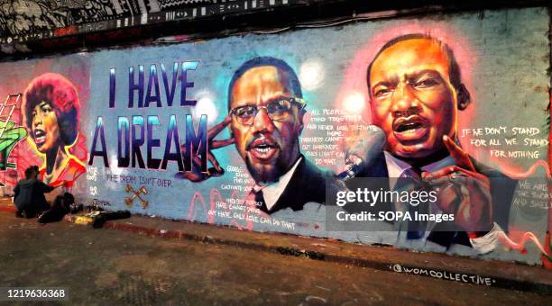 Street Art wall showing an image of civil rights campaigner Martin Luther King and reference to George Floyd killing. Black Lives Matter related...