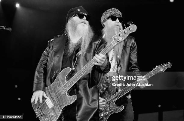 Musicians Dusty Hill and Billy Gibbons of the rock band ZZ Top are shown performing on stage during a "live" appearance on July 12,1993.