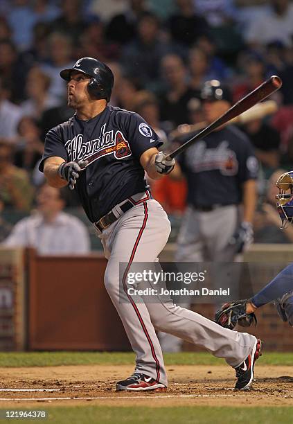 Dan Uggla of the Atlanta Braves takes a swing against the Chicago Cubs at Wrigley Field on August 23, 2011 in Chicago, Illinois. The Braves defeated...