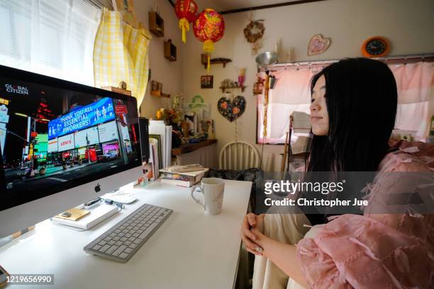 Japanese artist Mika Tamori in her home studio watches the live stream of "One World: Together At Home" presented by Global Citizen on April 19, 2020...