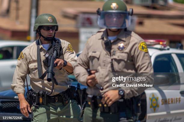 Sheriffs block marchers from continuing down E. Palmdale Boulevard after a demonstration on June 13, 2020 in Palmdale, California. The marchers were...