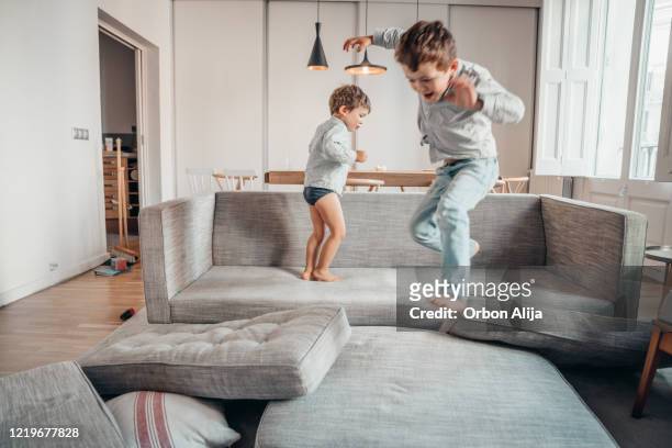 siblings playing at home during the covid-19 quarantine - kids fort stock pictures, royalty-free photos & images