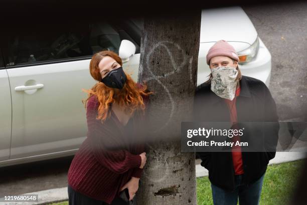 Samantha Weisberg and Lucas Grabeel wear protective masks while walking around Koreatown during the coronavirus Covid-19 pandemic on April 18, 2020...