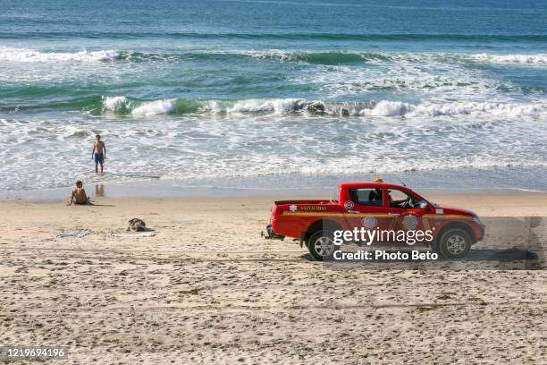 a mexican sea rescue patrol along the beach of tijuana in baja california near the us-mexico border - lifeguard stock pictures, royalty-free photos & images