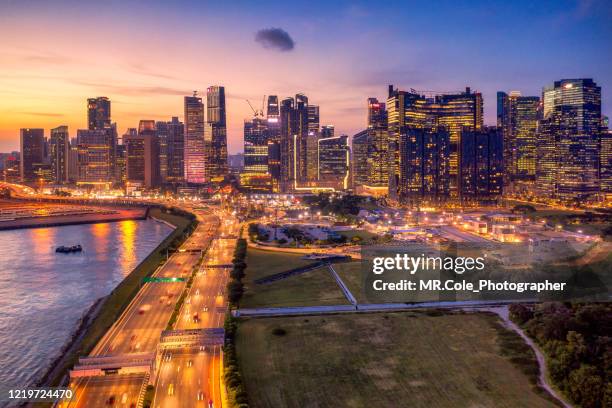 aerial view singapore city buildings in business district at twilight,financial economy, construction industry,or modern company organization - singapore city aerial stock pictures, royalty-free photos & images