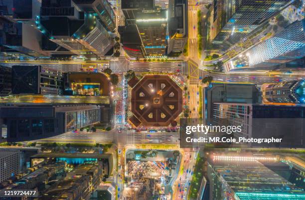 aerial view singapore city buildings in business district at night,financial economy, construction industry,or modern company organization concept - drone picture architekture stock pictures, royalty-free photos & images