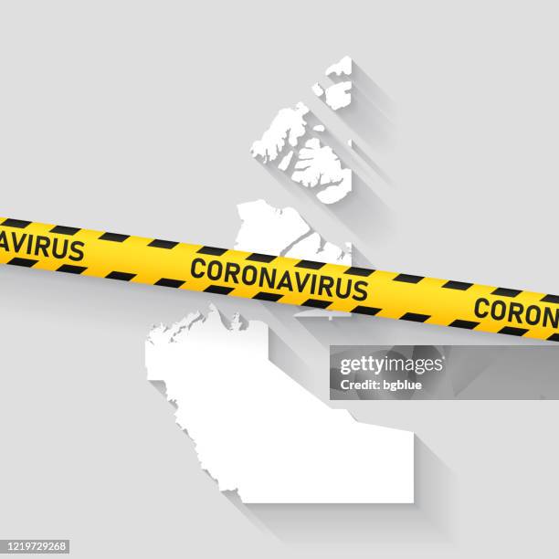 northwest territories map with coronavirus caution tape. covid-19 outbreak - yellowknife stock illustrations