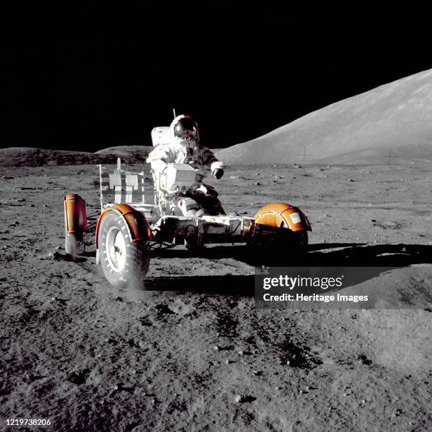 Apollo 17 The US's final expedition beyond low Earth orbit: Apollo 17, 1972. Gene Cernan driving the Lunar Roving Vehicle. Artist NASA.