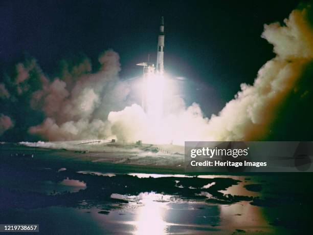 Apollo 17 A Saturn V rocket launches towards space on the night of December 17 carrying the Apollo 17 crew. Artist NASA.