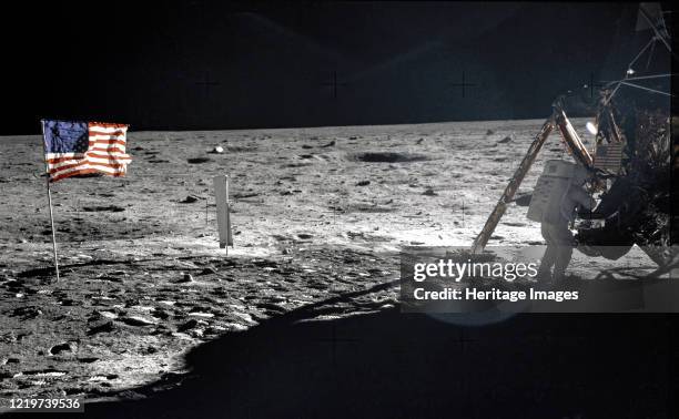 Apollo 11 A frame from Aldrin?s first panorama shows Armstrong packing samples in an open rock box. Remarkably, of the 121 photographs taken during...