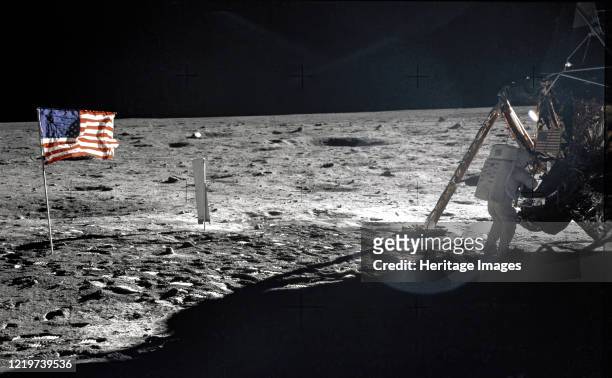 Apollo 11 A frame from Aldrin?s first panorama shows Armstrong packing samples in an open rock box. Remarkably, of the 121 photographs taken during...