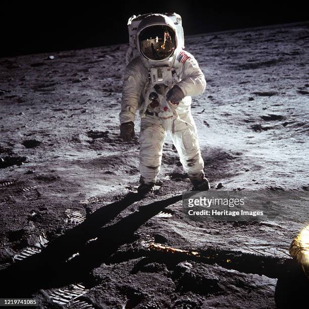 Apollo 11 Astronaut Buzz Aldrin walks on the surface of the moon near the leg of the lunar module Eagle during the Apollo 11 mission. Mission...
