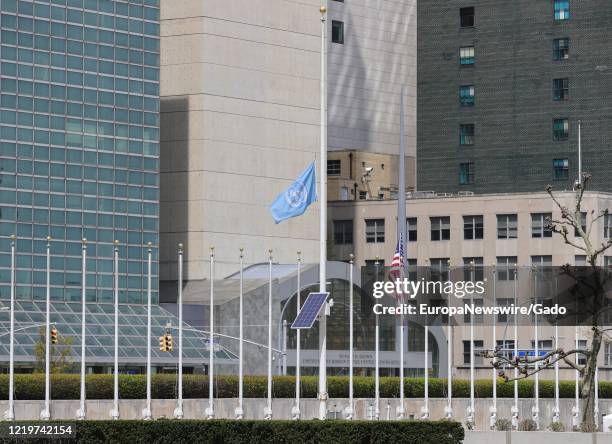 The flag of the United Nations flies at half mast at the UN Headquarters in New York City, New York, during an outbreak of the COVID-19 coronavirus,...