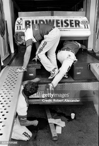 Members of NASCAR driver Darrell Waltrip's crew load their race car in the team's hauler after the running of the 1986 Daytona 500 stock car race at...