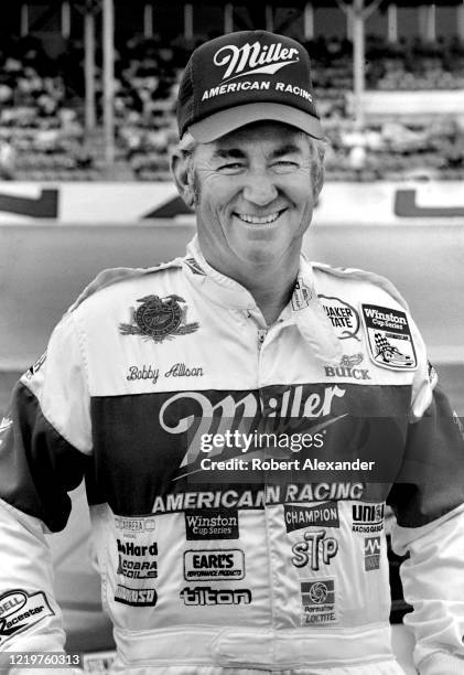 Race driver Bobby Allison poses for photographs prior to the start of the 1986 Daytona 500 stock car race at Daytona International Speedway in...