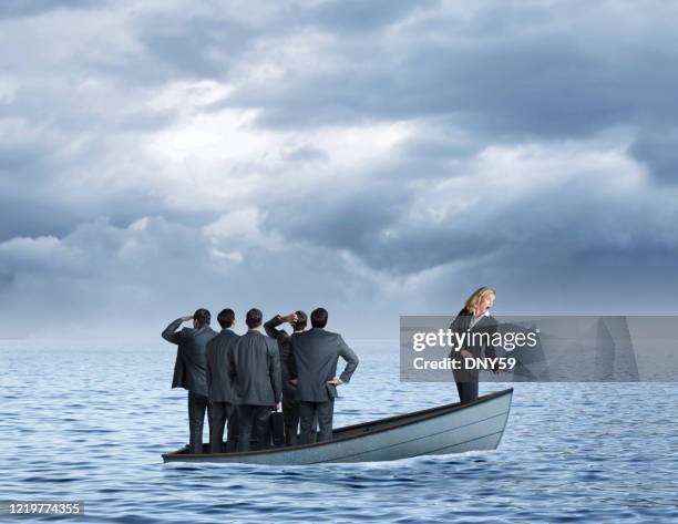 woman realizing group of men about to sink the boat - sink stock pictures, royalty-free photos & images