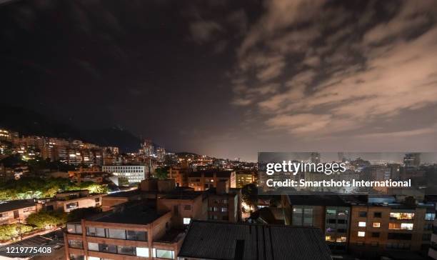 bogota skyline illuminated at night with several modern skyscrapers as seen from chapinero district, colombia - monserrate bogota stock pictures, royalty-free photos & images