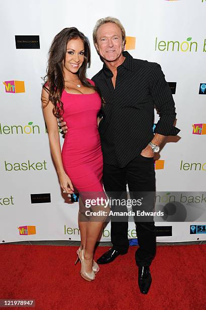 Bambi Lashell and Devin Haman arrive at the grand opening of Lemon Basket restaurant on May 11, 2011 in West Hollywood, California.